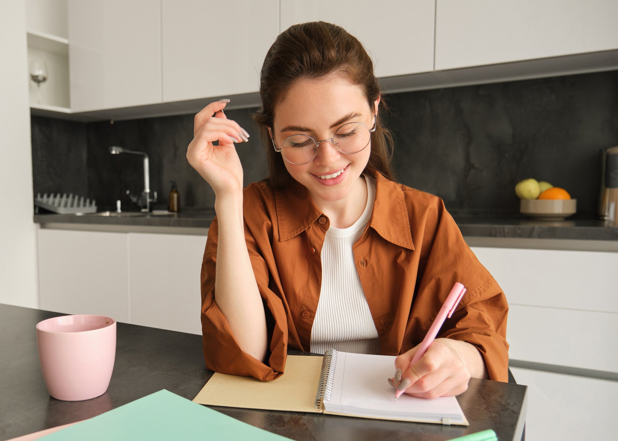 Smiling Woman Tutor Preparing Notes